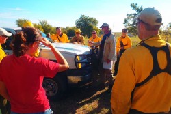 Team from The Nature Conservancy receive instructions prior to a test burn
